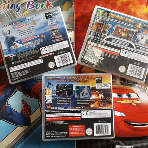 DS boxed games used, pack with Happy Feet, Kung Zhu, Tron Evolution
