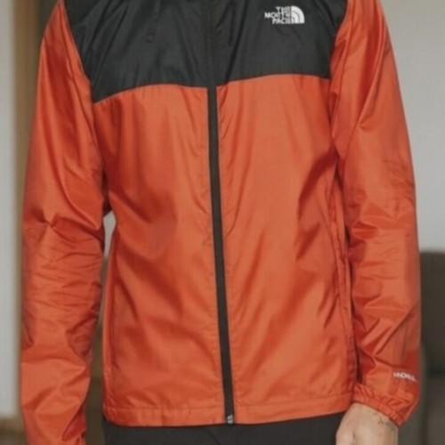 The North Face windbreaker jacket with hood like new, black and orange