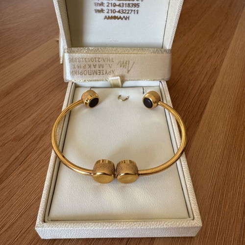 Steel bracelet like new, gold with black detail