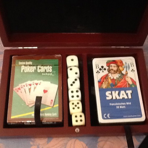 Wooden box with two new decks of cards and six dice with velvet lining
