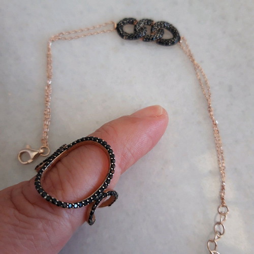 Silver set used with ring and black bracelet