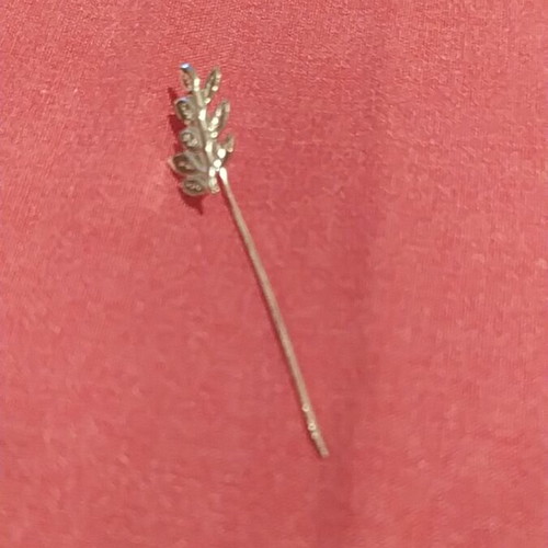 Vintage lapel pin used, silver color