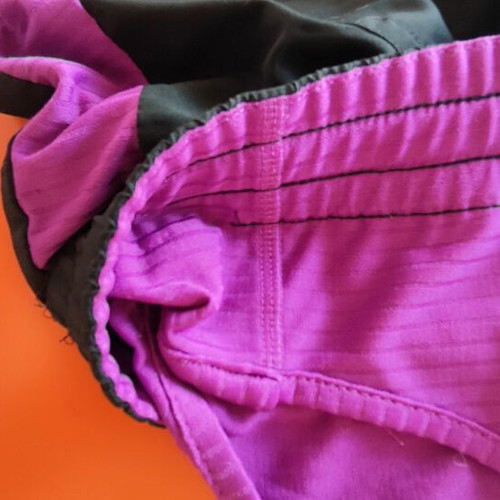 Reebok women's PlayDry ZigTech running shorts used, black and purple, size M