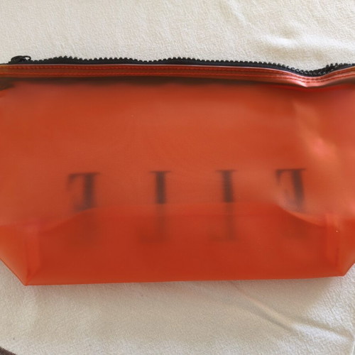 Elle toiletry bag set of 10 like new, translucent orange