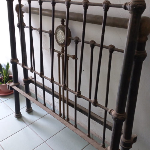 Solid iron bed with brass decorations used