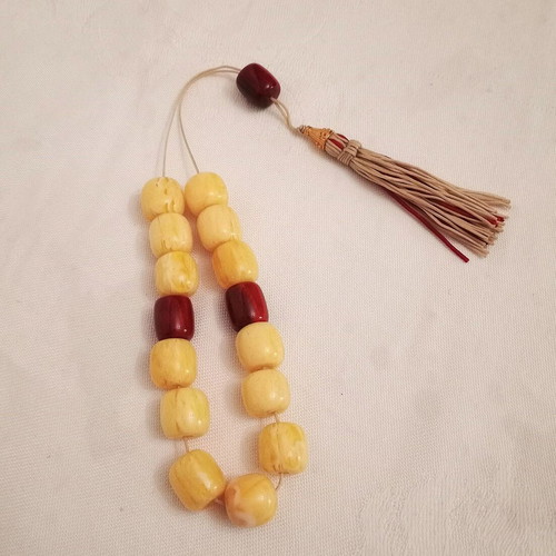 Worry beads with synthetic resin beads in yellow and burgundy, like new
