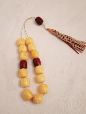 Worry beads with synthetic resin beads in yellow and burgundy, like new