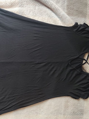 Black A-line dress like new, knee length with back laces and sleeve