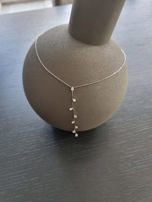 Necklace with hanging chain and stones