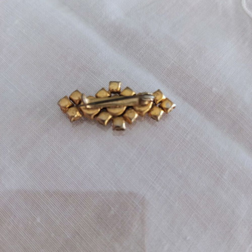 Bijou pin with rhinestones used, bronze base