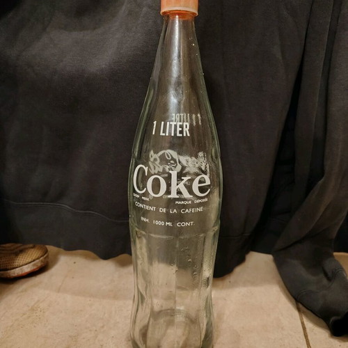 Coca-Cola bottle French like new with original cap