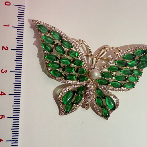 Vintage butterfly brooch with green cabochon stones and white zircon, like new
