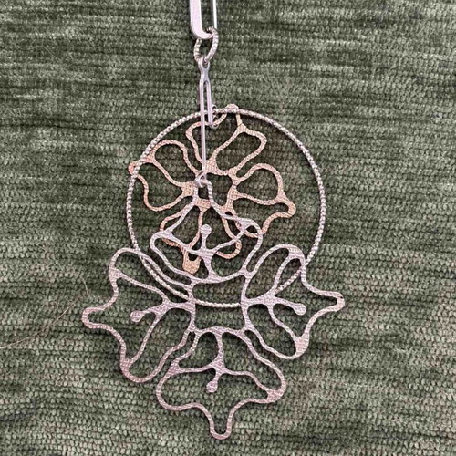 Loisir necklace new with floral design in silver tone
