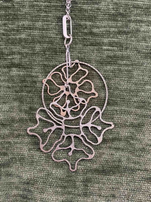Loisir necklace new with floral design in silver tone