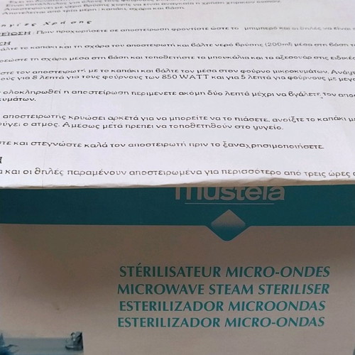 Mustela baby microwave sterilizer new with 4 biberon and nipples