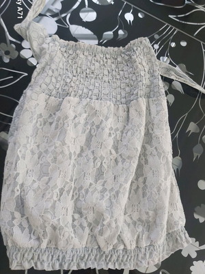 Off-shoulder top used with blue lace and swallow's nest detail on chest