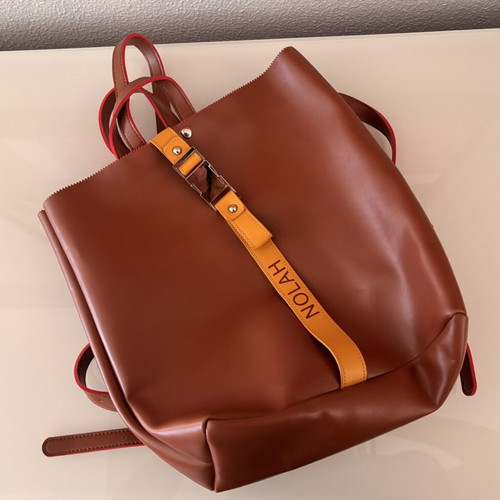 Nolah Backpack like new, brown with yellow strap