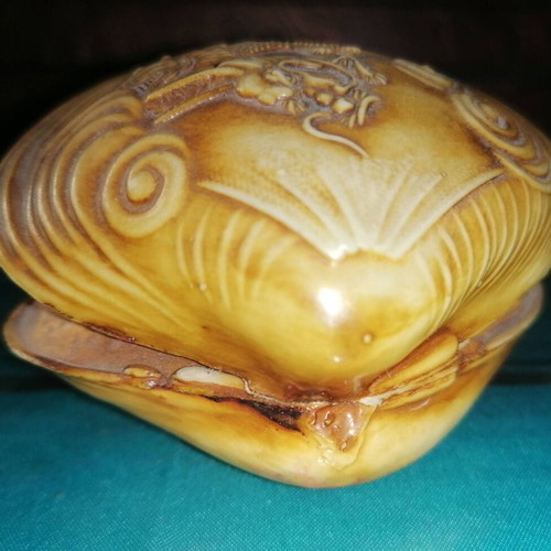 Vintage carved shell with dragon and scenic details