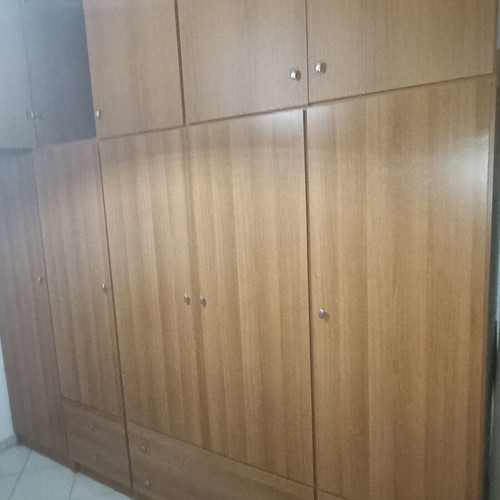 Furniture set like new including wardrobe, bed, table, drawers, sofa, and cabinet