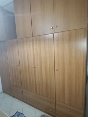 Furniture set like new including wardrobe, bed, table, drawers, sofa, and cabinet
