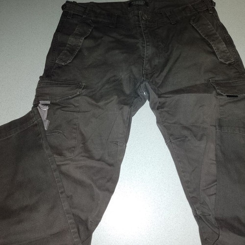 For sale, unworn Pringley cargo pants in dark olive // size 36. Price negotiable