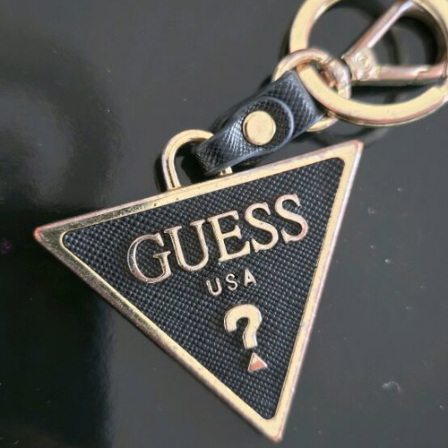 Guess keychain used, gold color