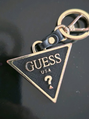 Guess keychain used, gold color