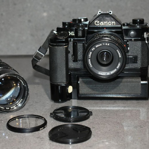 Canon A-1 collectible pack like new with Motor Drive, strap and 35mm f/2.8, 135mm lenses