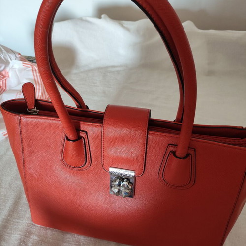Folli Follie Ladies Handbag used, burnt orange with flower fastening