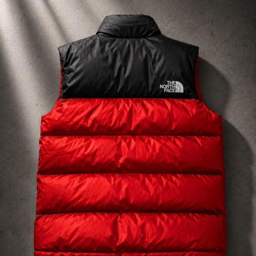 The North Face red and black puffer vest used, size M