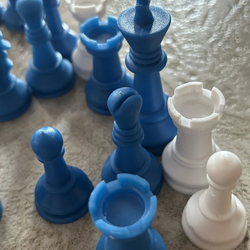 Vintage blue and white plastic chess pieces set
