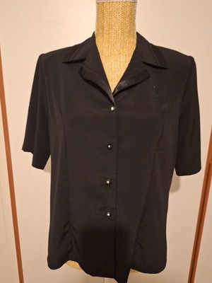 Viscose short-sleeve blouse black like new with delicate details