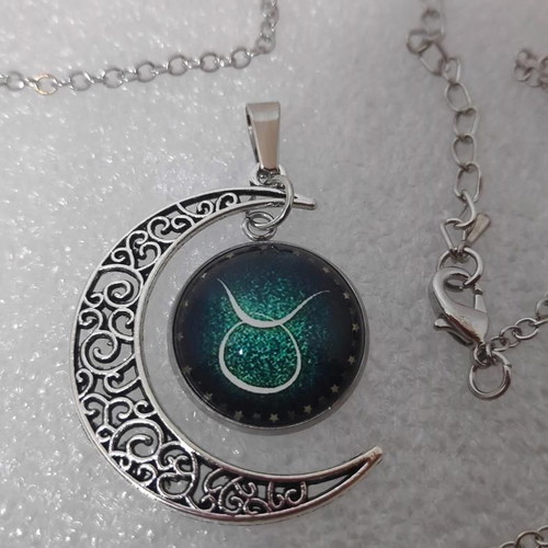 Pendant necklace with Taurus zodiac and crescent moon, like new