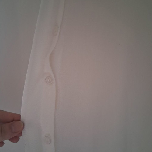 Sleeveless white shirt top