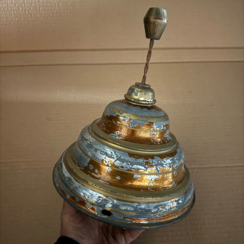 Old iron spinning top used in moderate condition