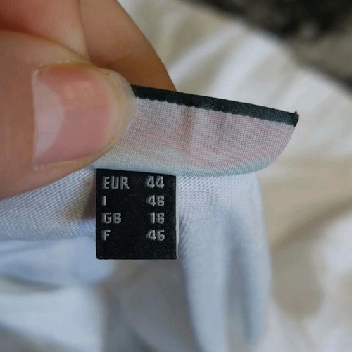 Blouse with transparency and buttons at bottom like new, white, size 44