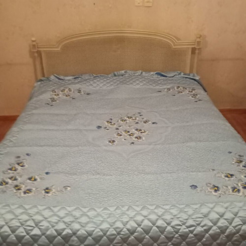 Vintage wooden double bed with wicker headboard, like new, includes slats and mattress