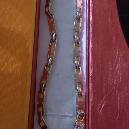 Necklace like new, gold color with white and red stones