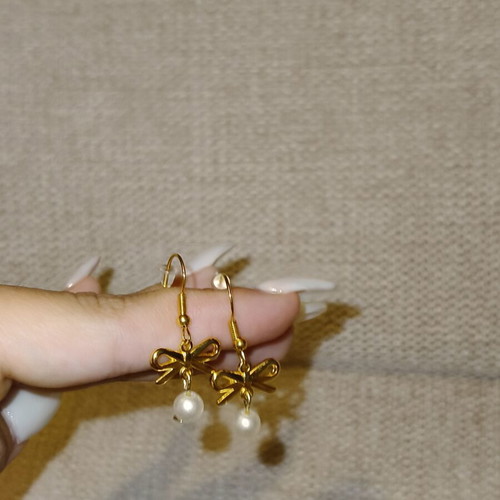 Handmade stainless steel earrings with bow and pearls