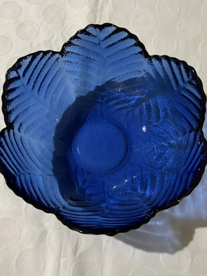 Vintage round blue glass vase with embossed flower design