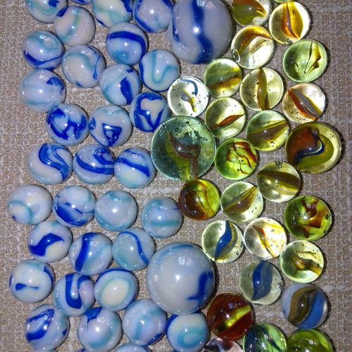 Collection of 68 used glass marbles in various sizes
