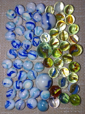 Collection of 68 used glass marbles in various sizes