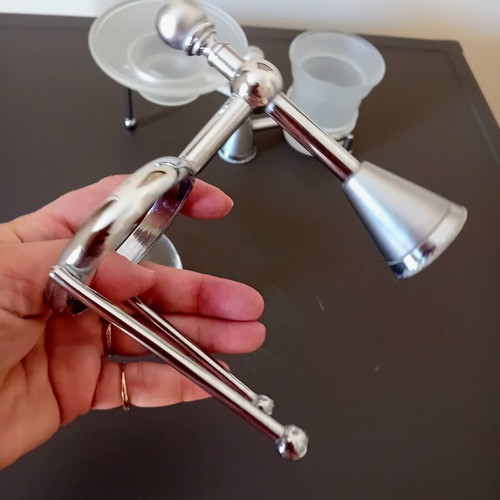 Two sets of inox bathroom accessories with glass and frosted parts