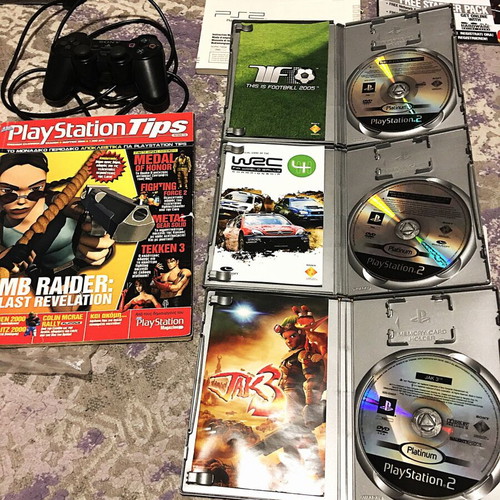 Playstation 2 Slim like new with steering wheel and 3 games