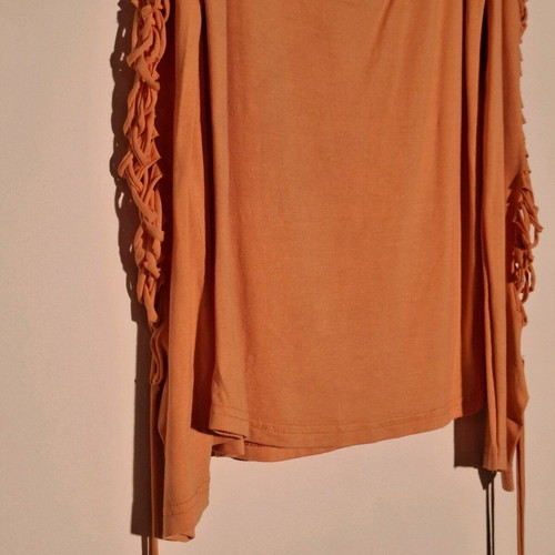 Orange shirt like new with knitted holes on sleeve