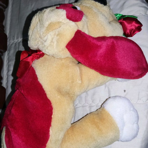 Stuffed dog used with heart and flower