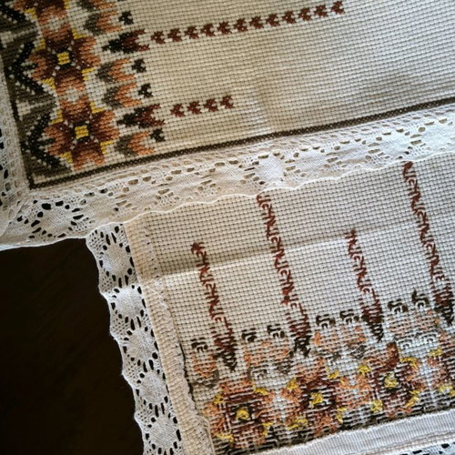 Handmade embroidered table runner with Cretan stitch and lace