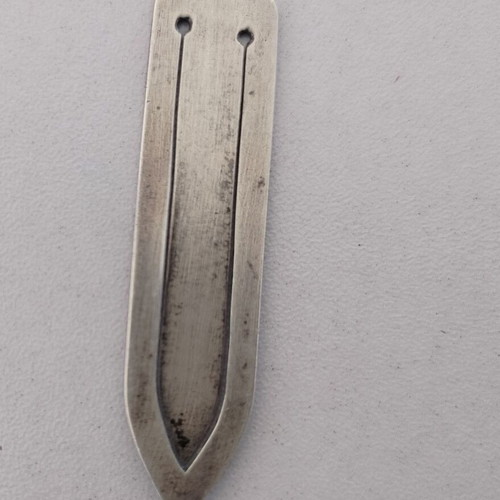 Silver bookmark with cross-shaped handle, used