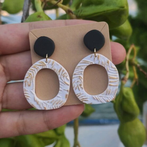 Earrings new, polymer clay with black, white, and gold colors