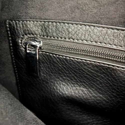 Black shoulder bag tote style like new with inner pockets and silver handle detail